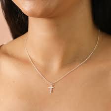 A cross pendant necklaces is a tiny thing with a monumental history.